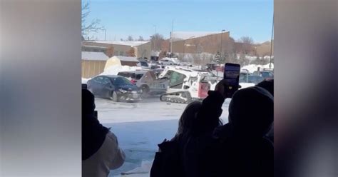 skid steer in street fight|Video shows Nebraska man ramming skid loader into police car.